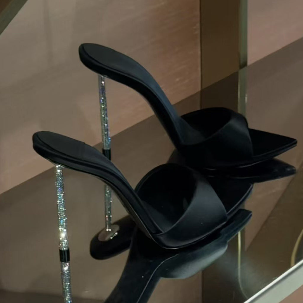 High-end black satin pointed-toe sandals with rhinestone stiletto heels for women, perfect for wearing as outerwear.